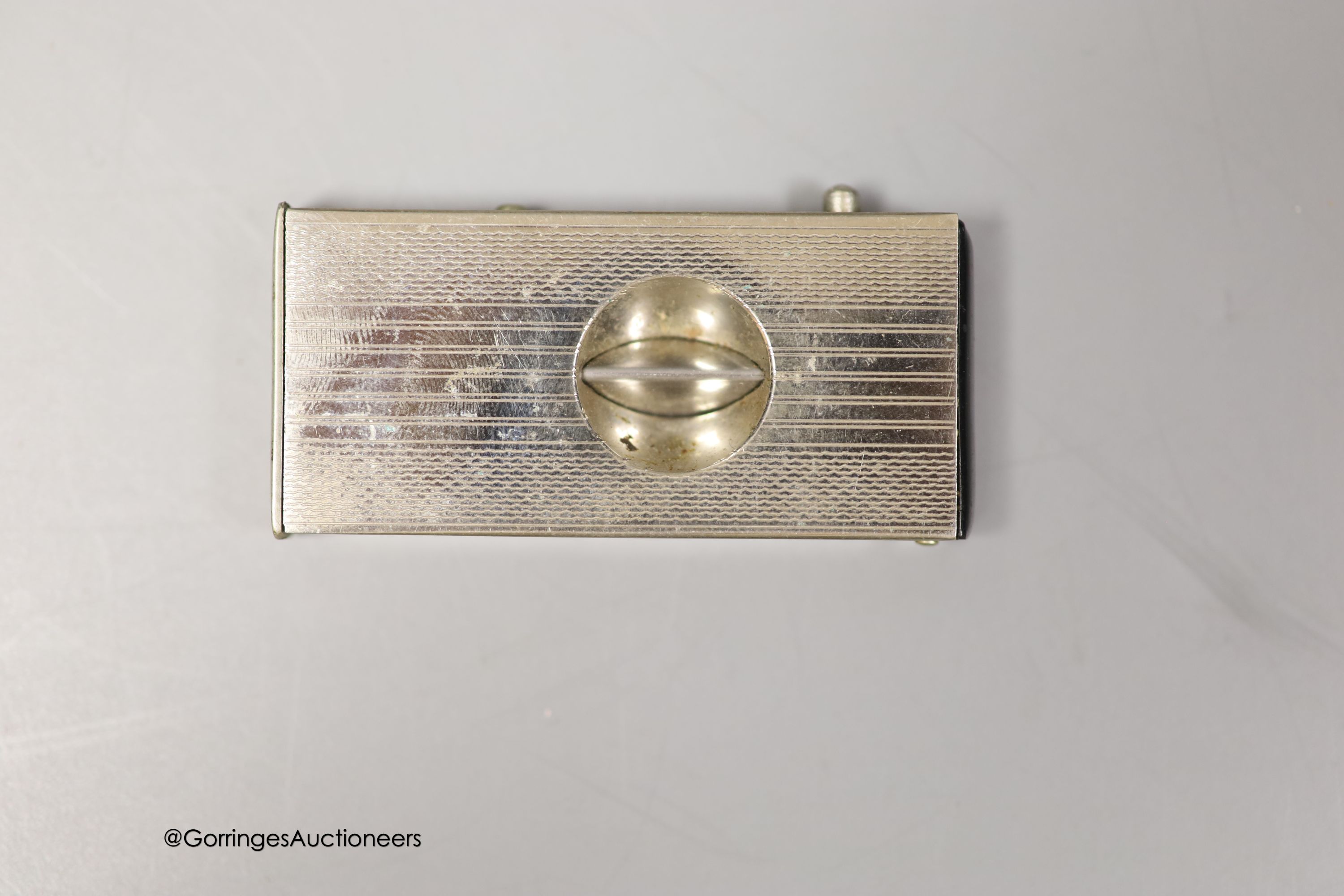 A German 935 white metal and enamel cigarette case, with interior inscription, 'In gratitude For Your Sincere Friendship, The Jewish Community, Luneberg, January, 1948', 87mm, together with a base metal cigar cutter and